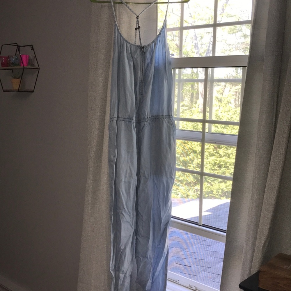 Light blue jumpsuit with cris cross back